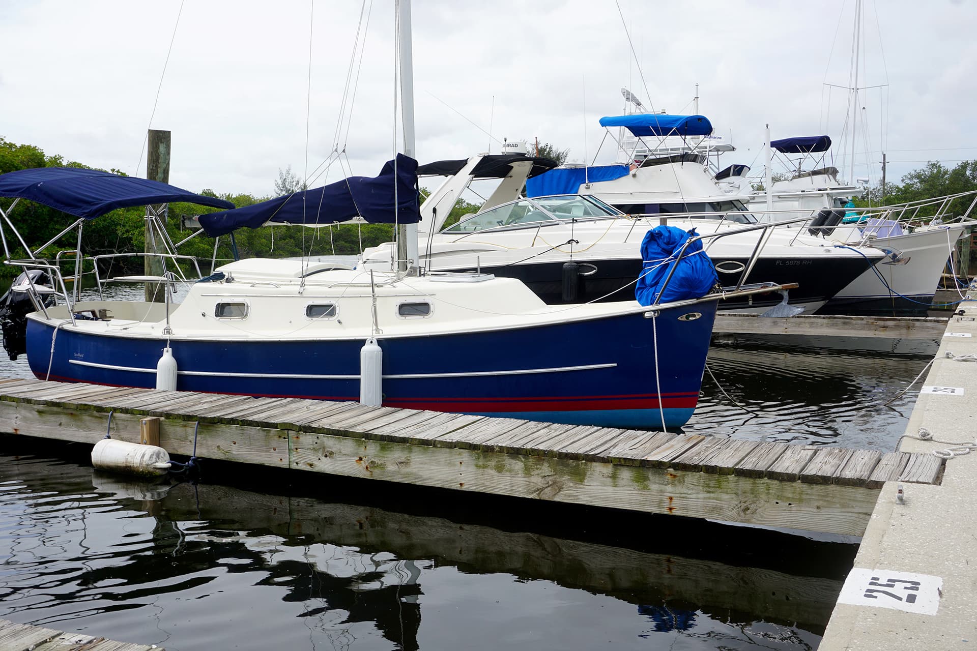 Cut's Edge Marina storage and repairs sign at the yard entrance
